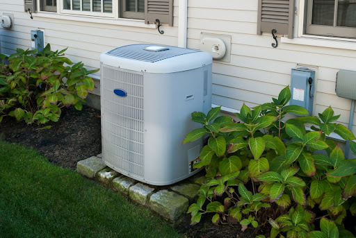 Outdoor air conditioning unit sitting outside of Cayman Islands home.