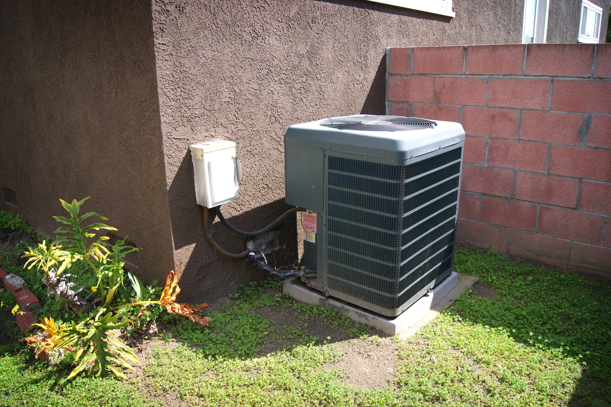 Outdoor central air unit sitting outside of Cayman Islands home.