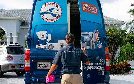 A technician opening a Polar Bear-branded truck.